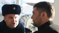 Эмиль Курбединов и полицейский. Фото Александры Ефименко для Граней.Ру